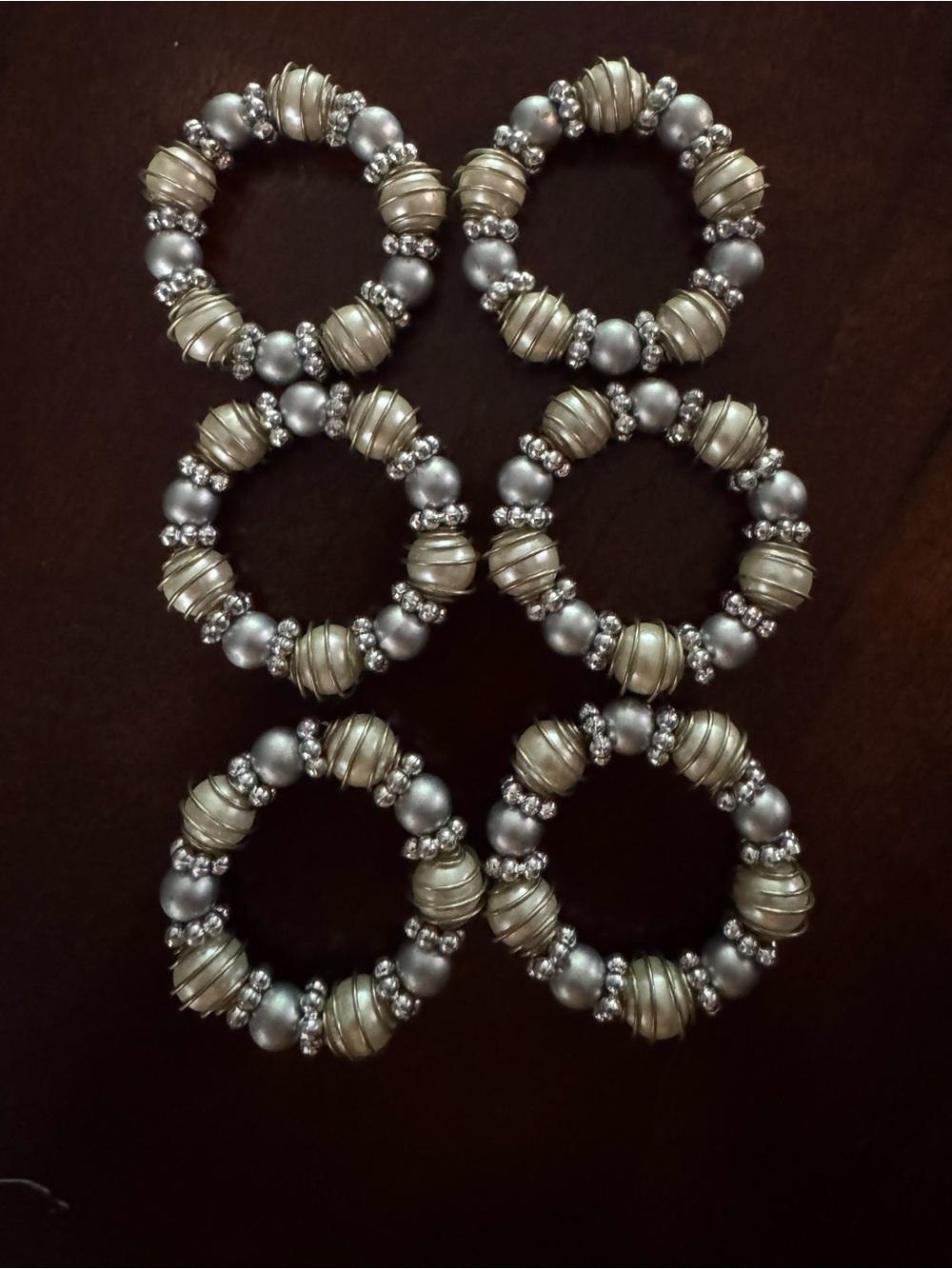 Six Silver and Pearl Napkin Rings (6)
